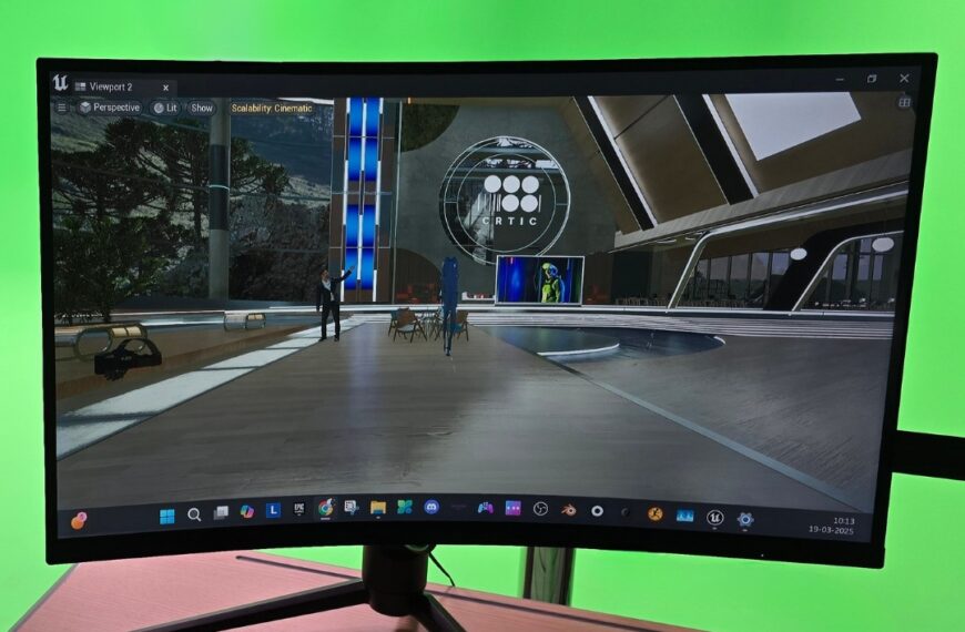 Monitor frente a una pantalla verde muestra el diseño virtual de un escenario en Unreal Engine. Título: Laboratorio tecnológico de CRTIC